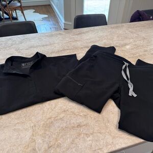 Figs Scrubs - black top and Yolo bottoms